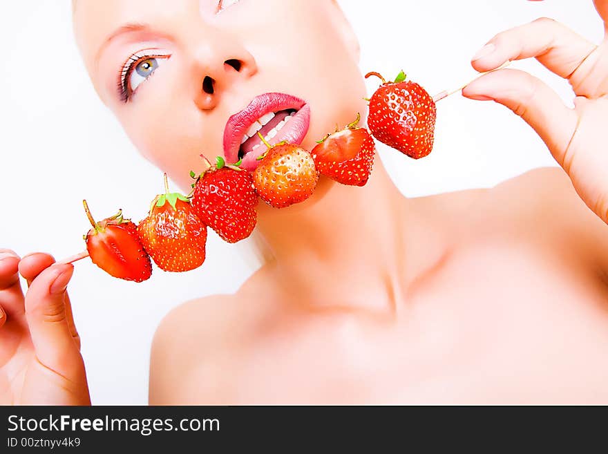 Sexy girl with red strawberry isolated on white