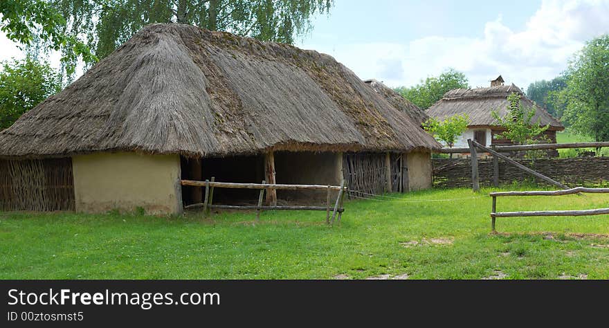 Straw ancient houses on a lawn. Straw ancient houses on a lawn