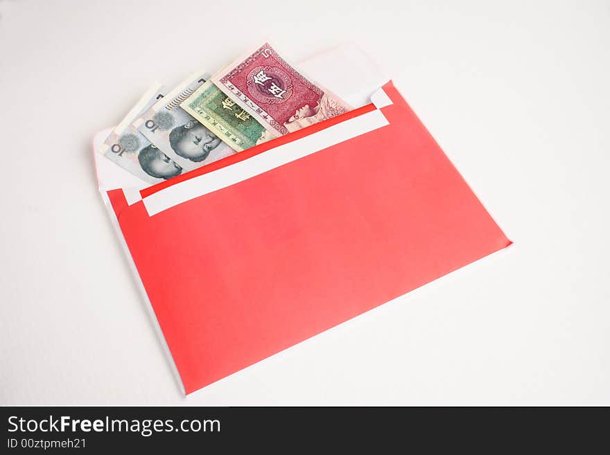 Chinese money in a red envelope isolated. Chinese money in a red envelope isolated