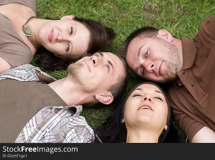 Friends together relaxing on grass. Friends together relaxing on grass