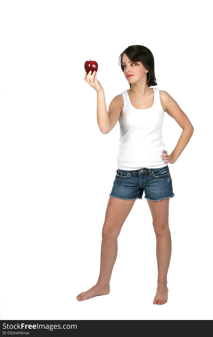 Helathy looking teenage girl holding red apple