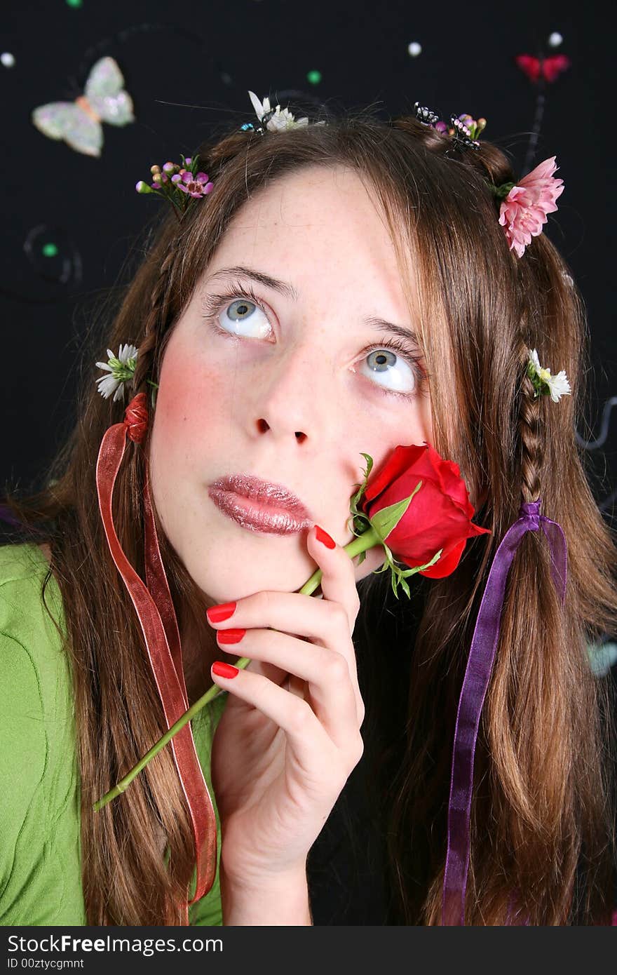 Teenage model with flowers and butterflies in her hair. Teenage model with flowers and butterflies in her hair