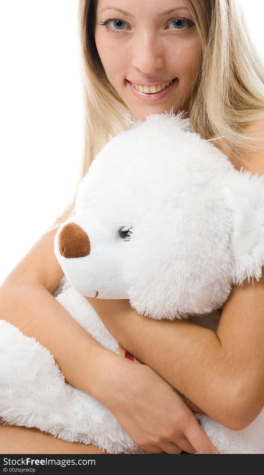 Close-up lovely young blonde girl with teddy bear isolated on white background