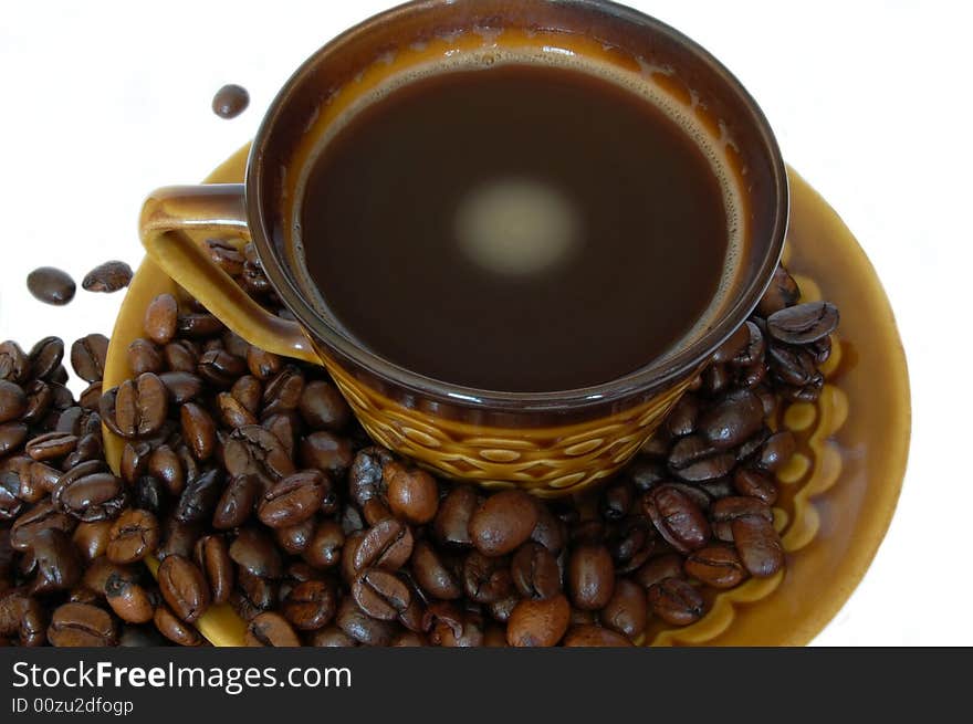 Cup of coffee with coffee beans isolated on the white background