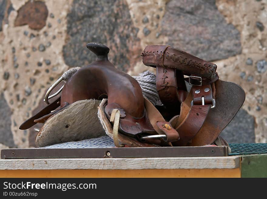 Close up image of an old leather saddle