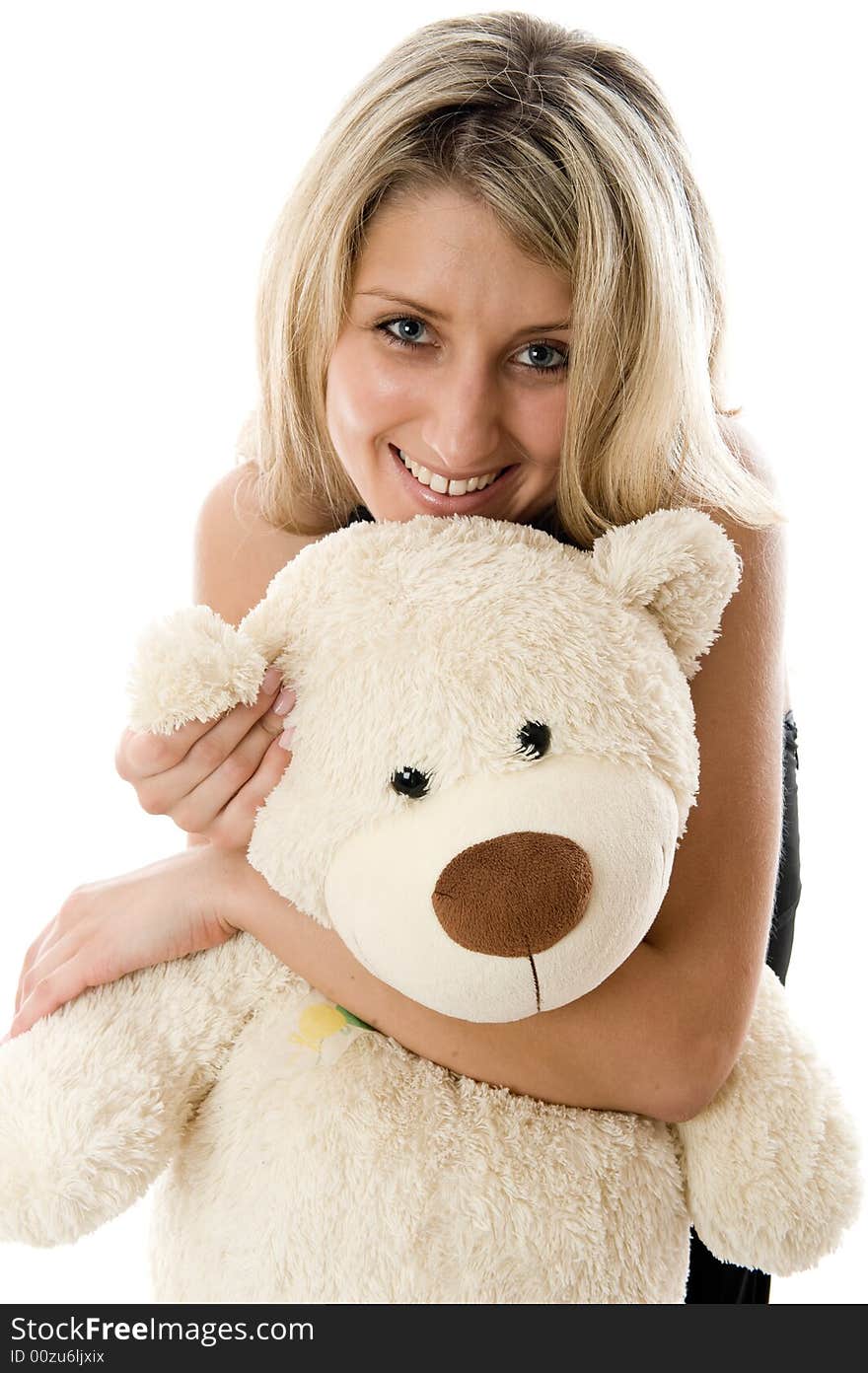 Close-up lovely young blonde girl with teddy bear isolated on white background