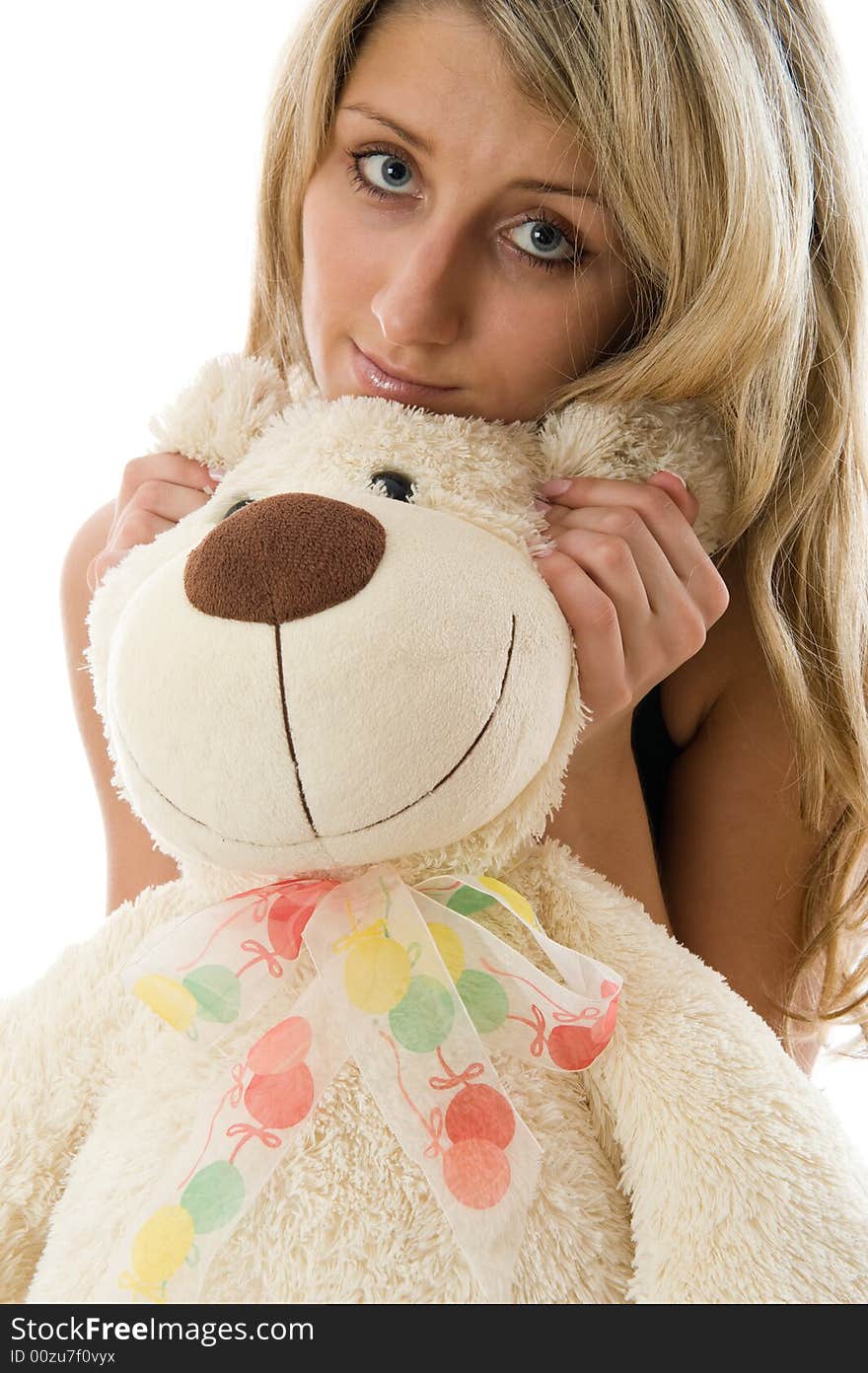 Close-up lovely young blonde girl with teddy bear isolated on white background