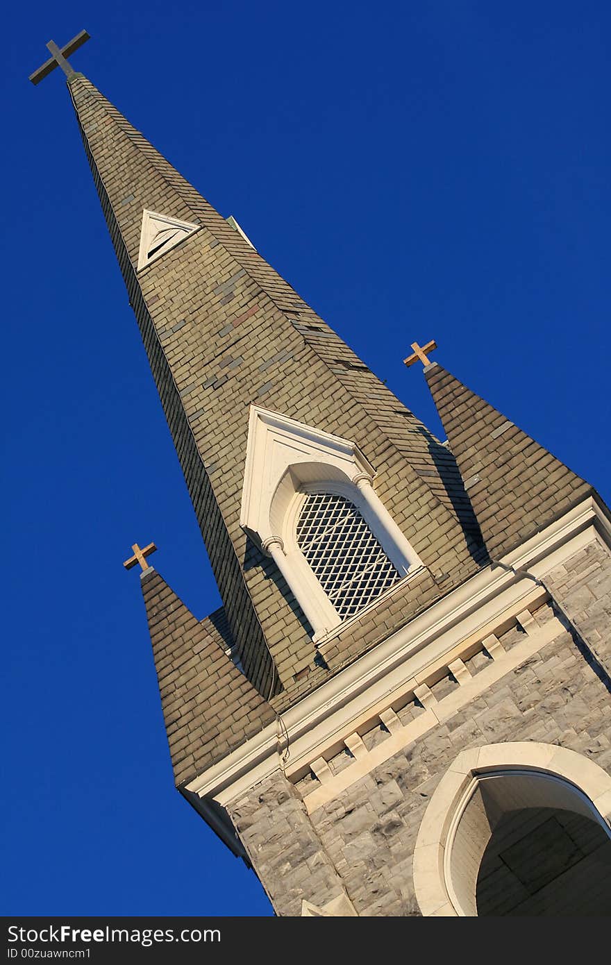 Church Tower with Three Crosses in a village