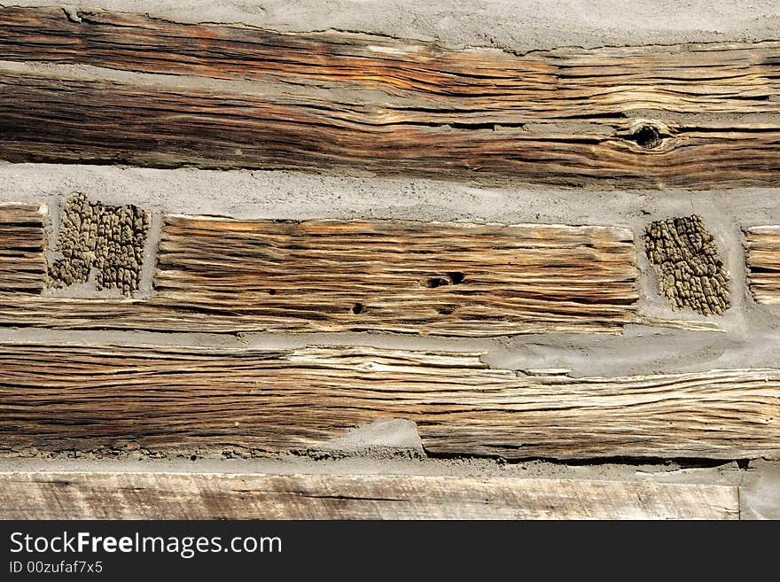 Log cabin detail from building circa 1855. Renovation is preserving the building which features rich weathered hand hewn logs. Log cabin detail from building circa 1855. Renovation is preserving the building which features rich weathered hand hewn logs.