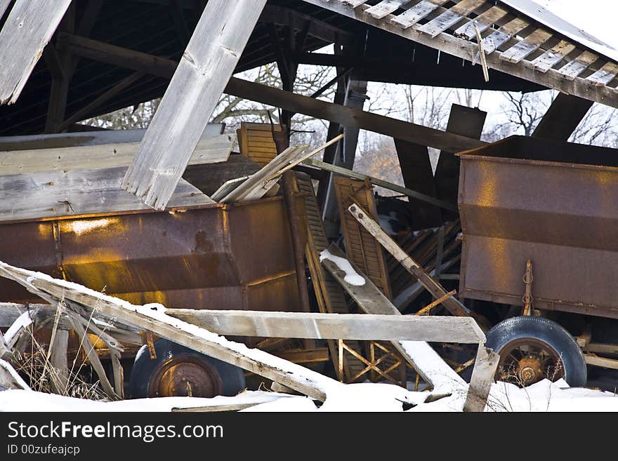 Tumbled down farm shed with equipment. Tumbled down farm shed with equipment