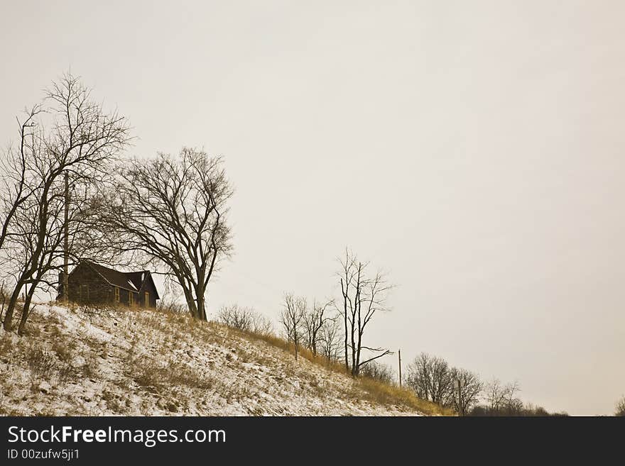 House on top of a hill in winter. House on top of a hill in winter