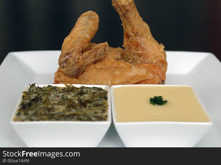 Southern fried chicken with creamed spinach and mashed potatoes. Southern fried chicken with creamed spinach and mashed potatoes