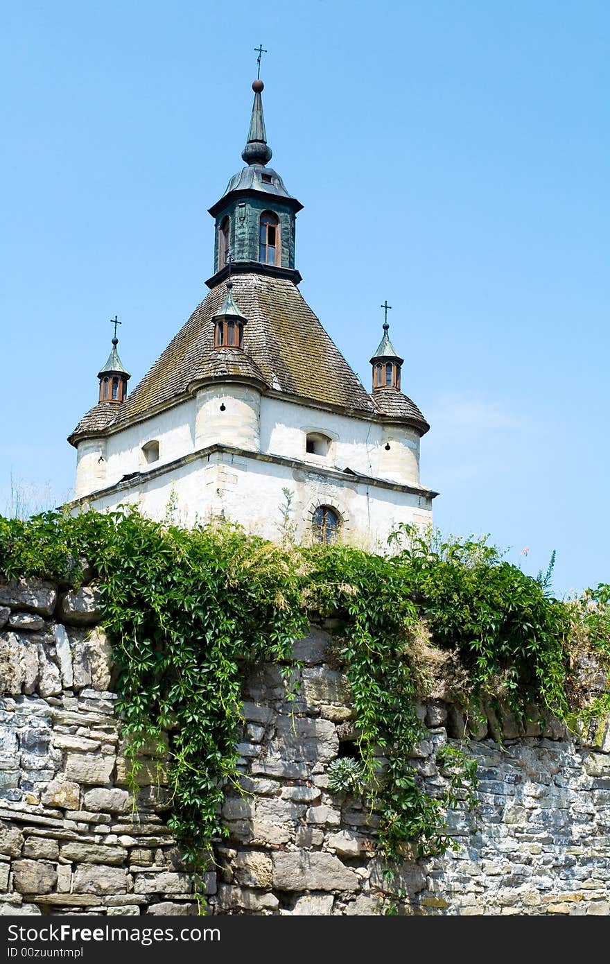 An image of stones tower with stones wall. An image of stones tower with stones wall