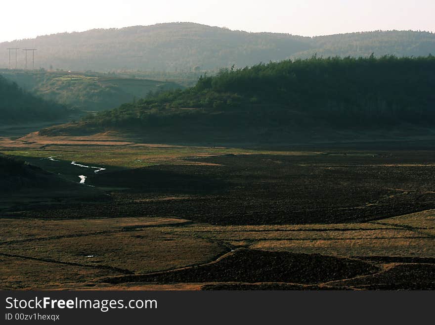 Farmland disappearing from my sight. There's a beautiful place of my home town, but, The government will use it for development, soon there will be a lost land.