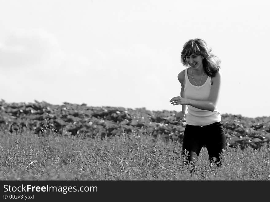 A beautiful girl running on the field