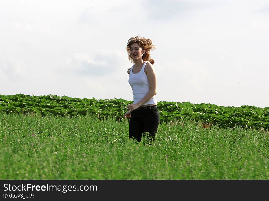 A beautiful girl running on the field