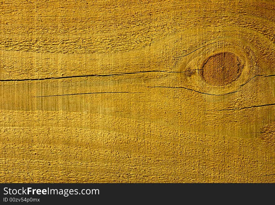 Close-up of a pine plank with a knot in it. Close-up of a pine plank with a knot in it.