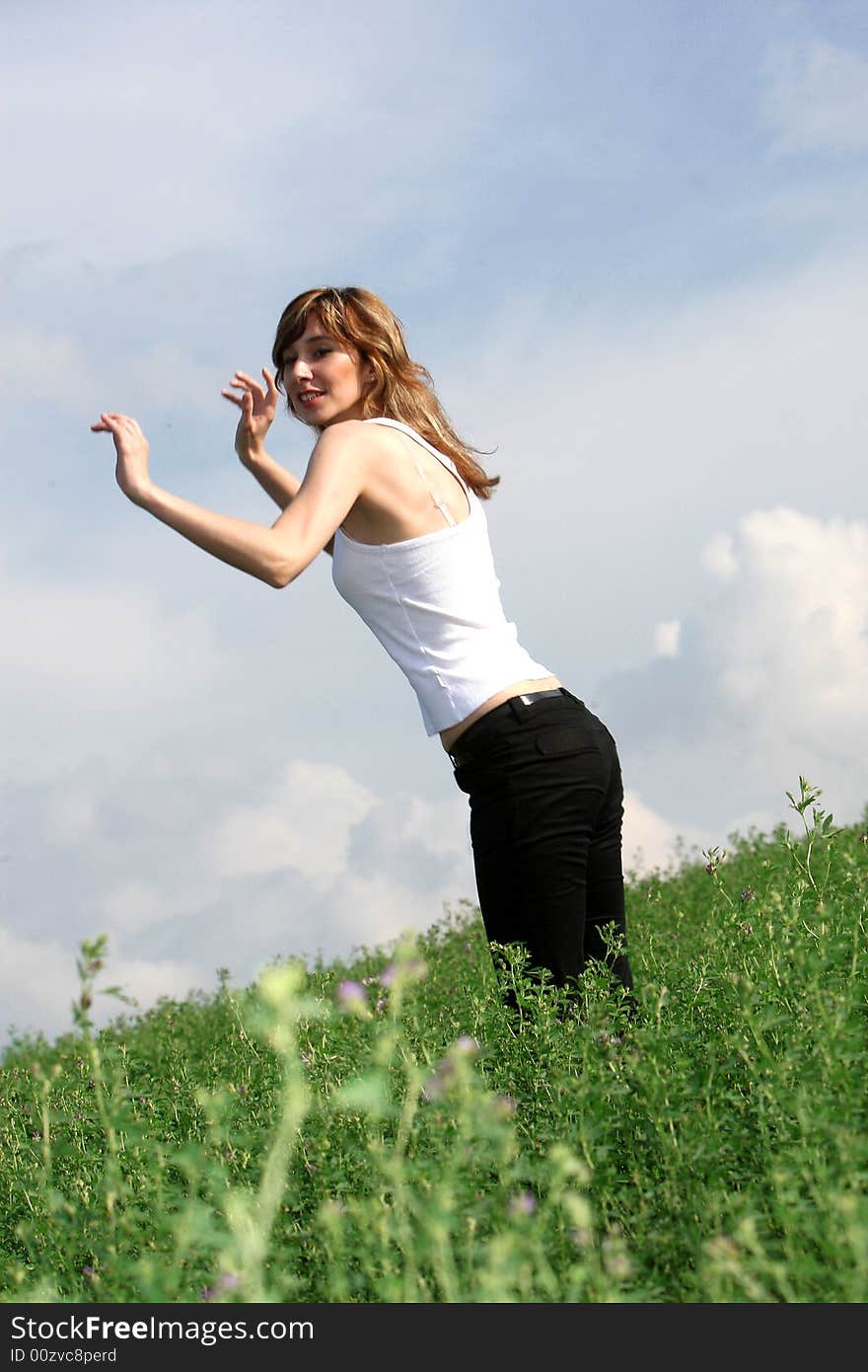 A beautiful girl jump on the field