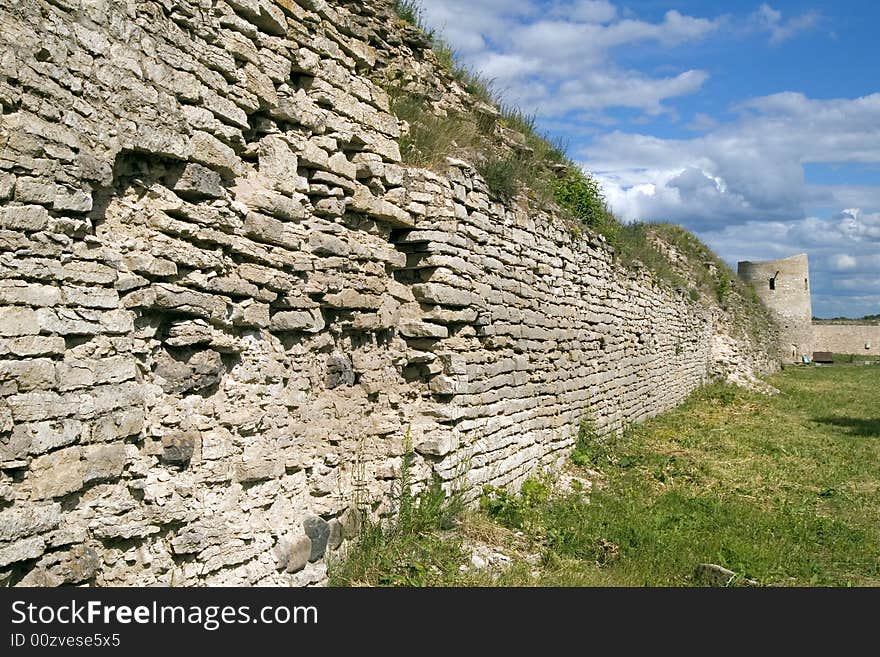 Old fortification wall  with a grass, Izbork, Pskov region, Russia, XI century