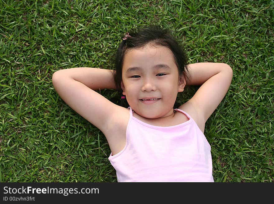 Girl lying on the grass