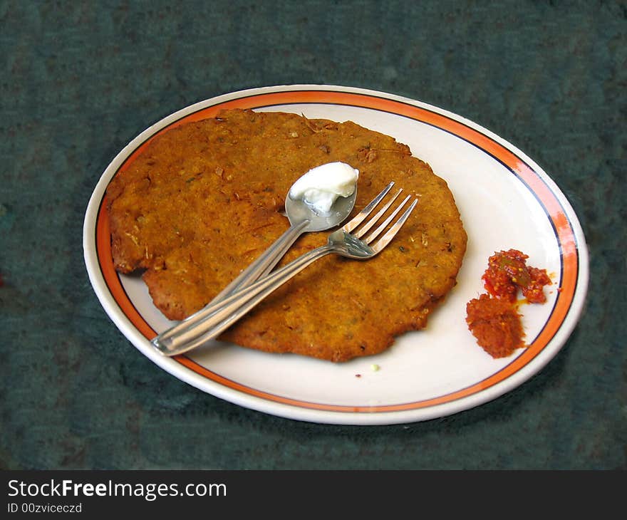 A tasty dish of Indian crusine with butter on top