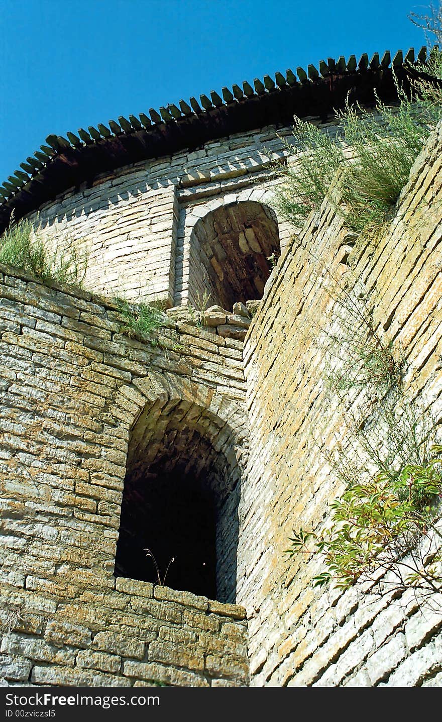 Embrasures of old brick fortress from below. Embrasures of old brick fortress from below