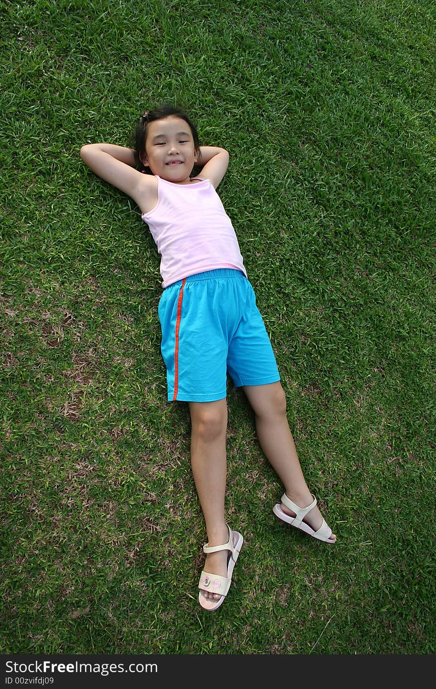 Girl Lying On The Grass