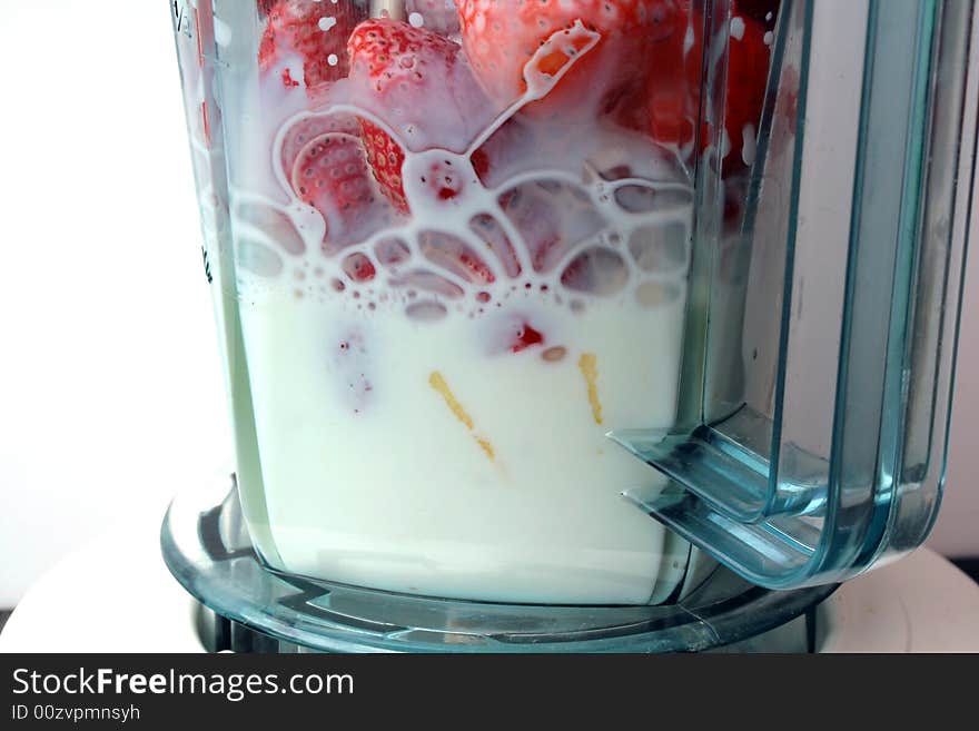 Strawberries and apple in blender