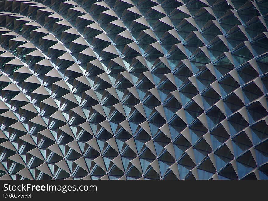 An abstract view of the aluminium sun shades, shielding the glass of the Esplanade Theatres. The Esplanade - Theatres on the Bay, Singapore. An abstract view of the aluminium sun shades, shielding the glass of the Esplanade Theatres. The Esplanade - Theatres on the Bay, Singapore.