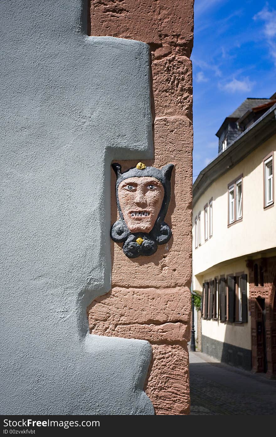 Stone face in old building