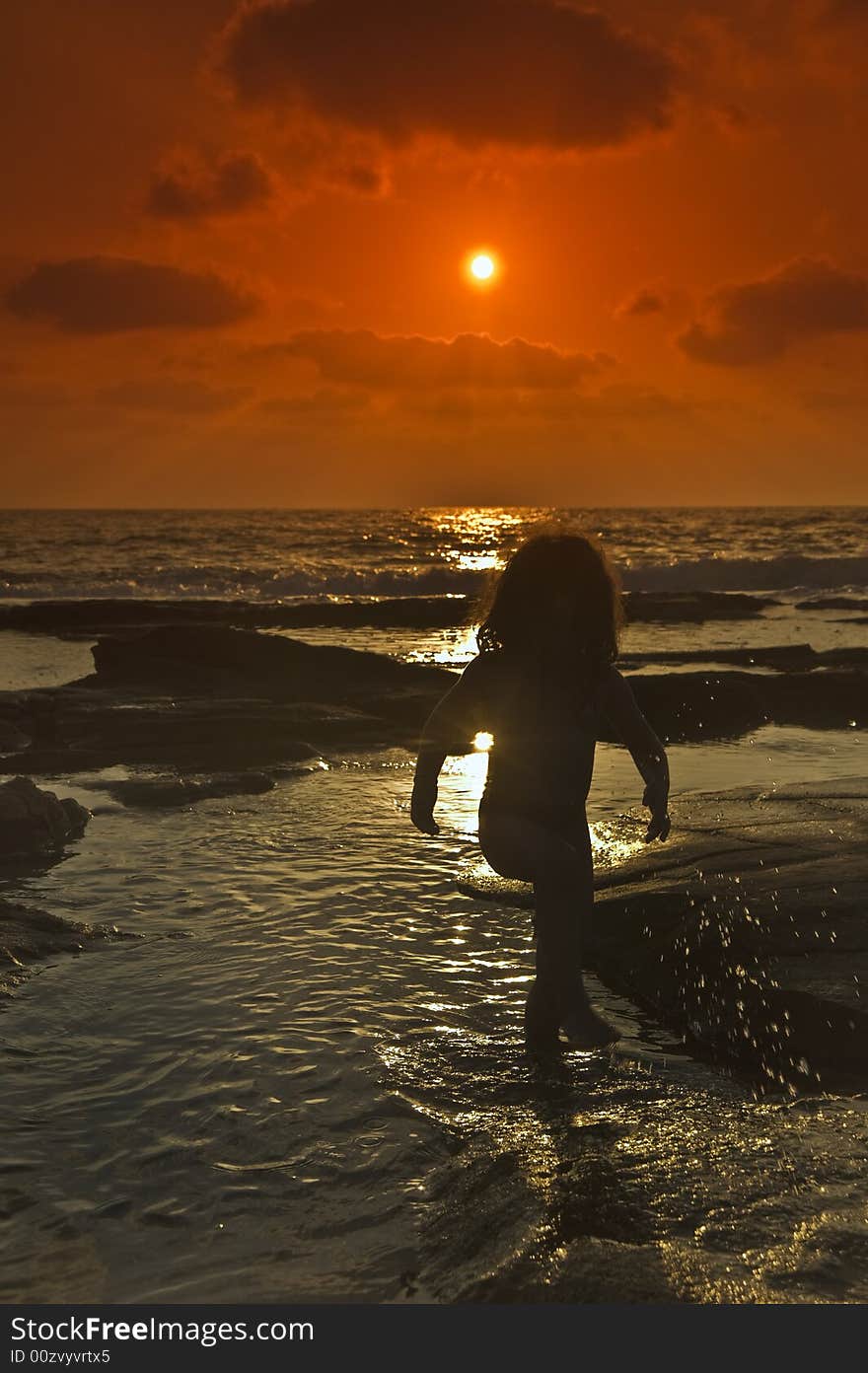 Little girl at the beach in sunset. Little girl at the beach in sunset