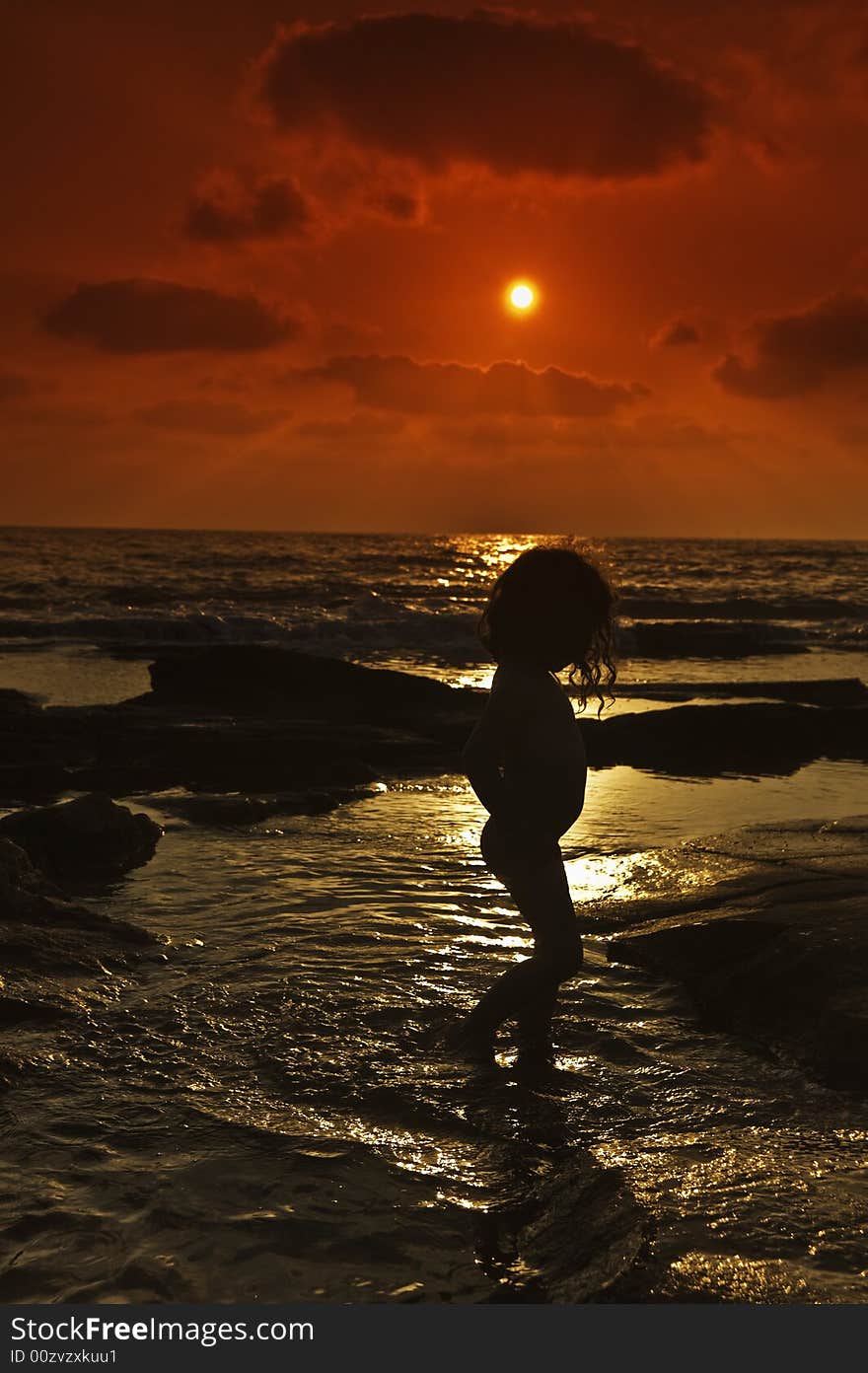 Little girl at the beach in sunset. Little girl at the beach in sunset