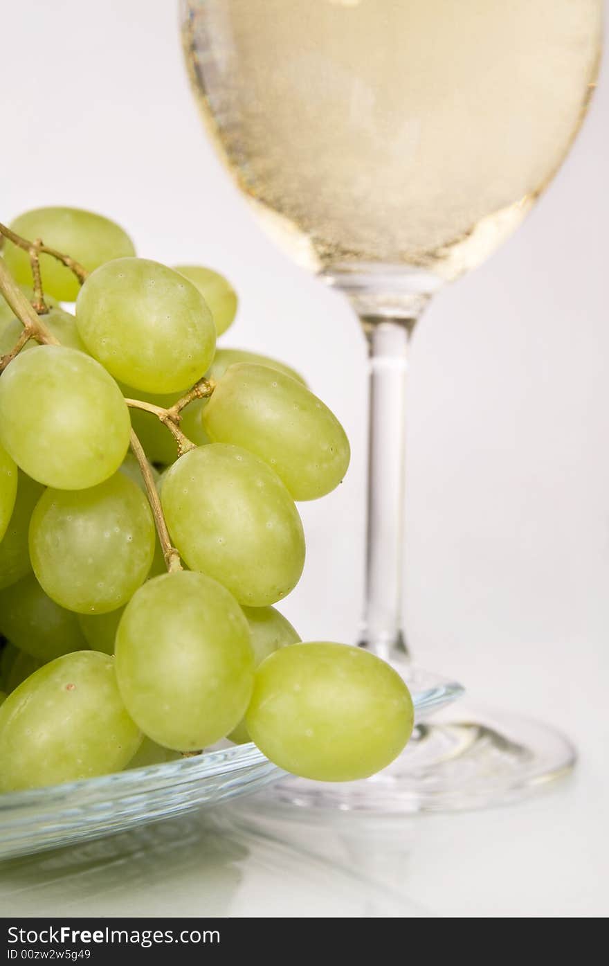 Glass of white wine and grapes. Glass of white wine and grapes.