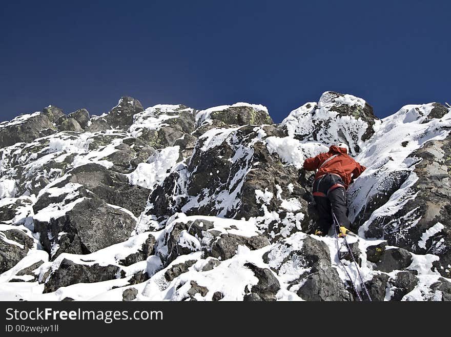 Climber scaling final pitch of Mount Thielsen. Climber scaling final pitch of Mount Thielsen