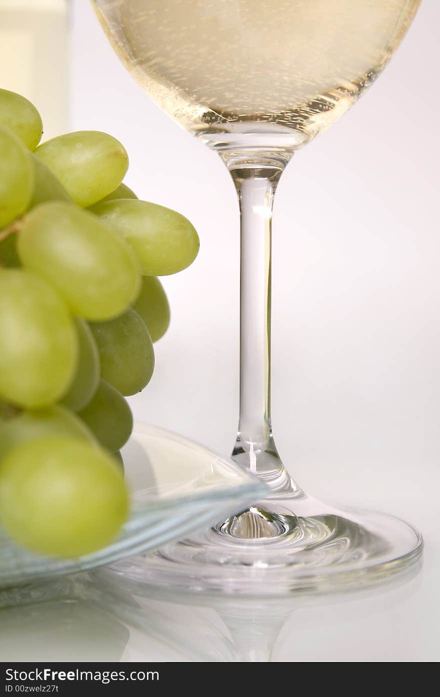 Glass of white wine and grapes. Glass of white wine and grapes.