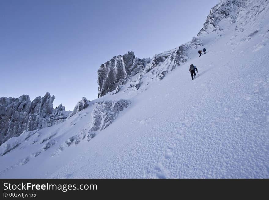 Climbers accending a snow slope on Mount Thielsen. Climbers accending a snow slope on Mount Thielsen