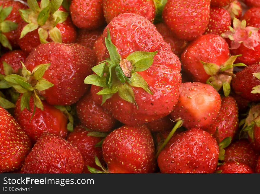 Fresh picked strawberries filling the image frame