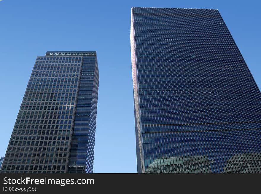 Two skyscrapers with a clear sky background. Two skyscrapers with a clear sky background