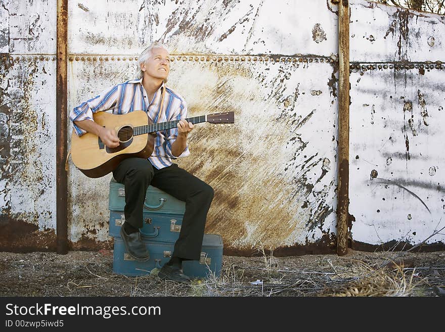 Handsome guitar player