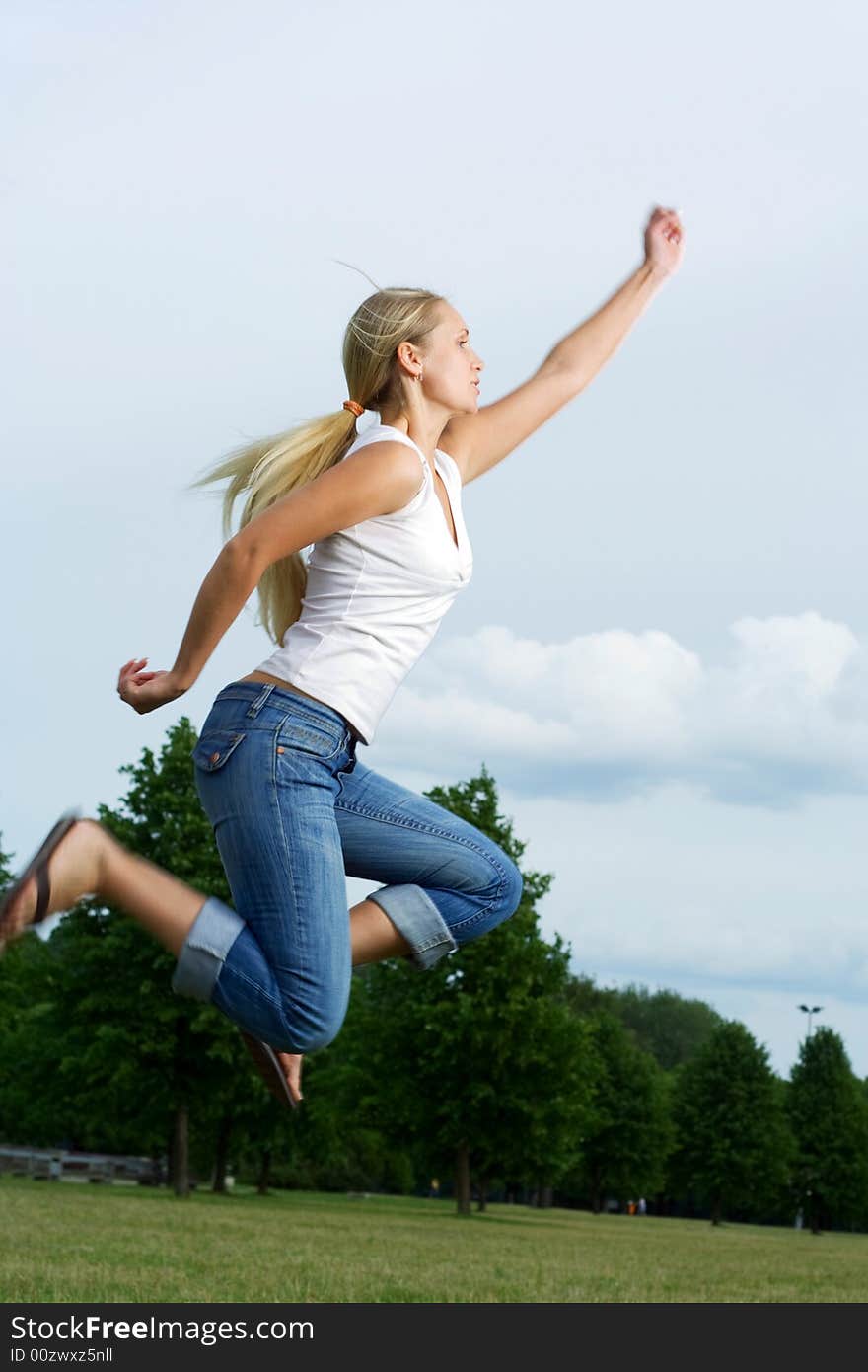 Jumping woman in the park. Jumping woman in the park.