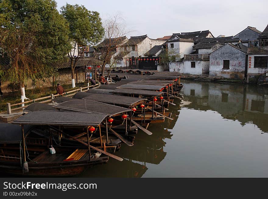 Xitang Town is an ancient town in the north of Jiashan County。To call this lovely water-village an oriental Venice would be wildly over the mark, yet it shares similarities with its more famous Italian counterpart. Canals dissect twisting narrow lanes and pathways, rendering the community traffic-free and boat friendly. Worn stone steps lead down to the waters and hopelessly pretty bridges span them. But Xitang is on an altogether smaller, happily domestic scale, and no matter how hard it tries, tourism is mercifully still in its infancy. Xitang Town is an ancient town in the north of Jiashan County。To call this lovely water-village an oriental Venice would be wildly over the mark, yet it shares similarities with its more famous Italian counterpart. Canals dissect twisting narrow lanes and pathways, rendering the community traffic-free and boat friendly. Worn stone steps lead down to the waters and hopelessly pretty bridges span them. But Xitang is on an altogether smaller, happily domestic scale, and no matter how hard it tries, tourism is mercifully still in its infancy.