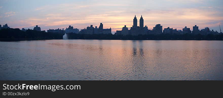 Manhattan sunset over the reservoir in central park