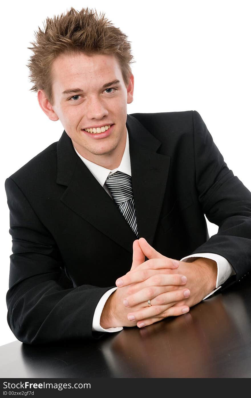 A young businessman sitting in his office