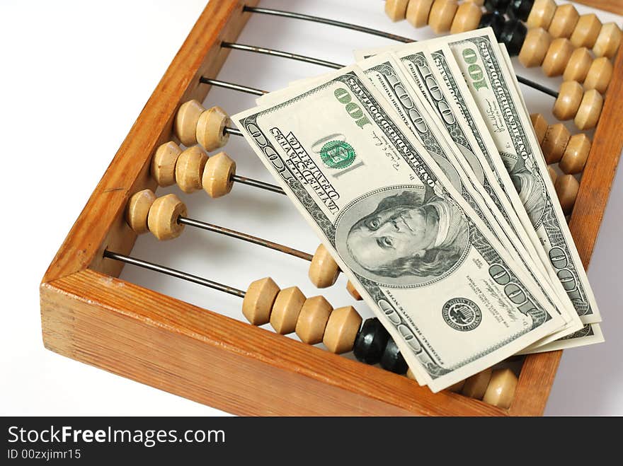 Abacus and dollar. Old abacus symbolizing the last time and new dollars. Abacus and dollar. Old abacus symbolizing the last time and new dollars