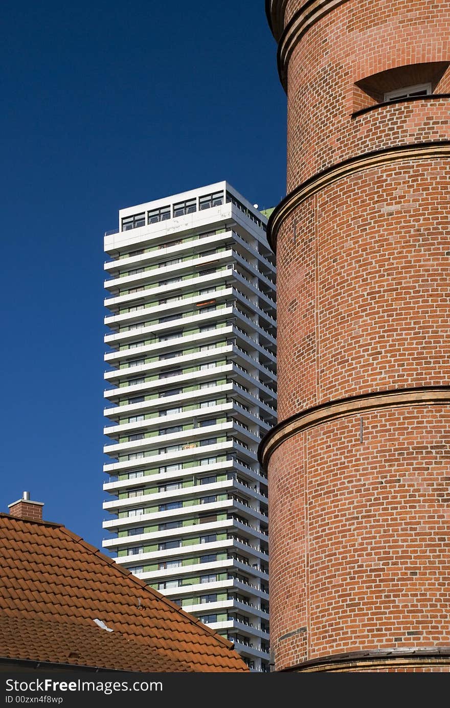 Lighthouse and skyscraper in travemuende, germany