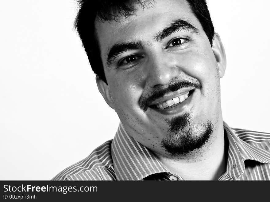 Black and white portrait of young confident businessman smiling