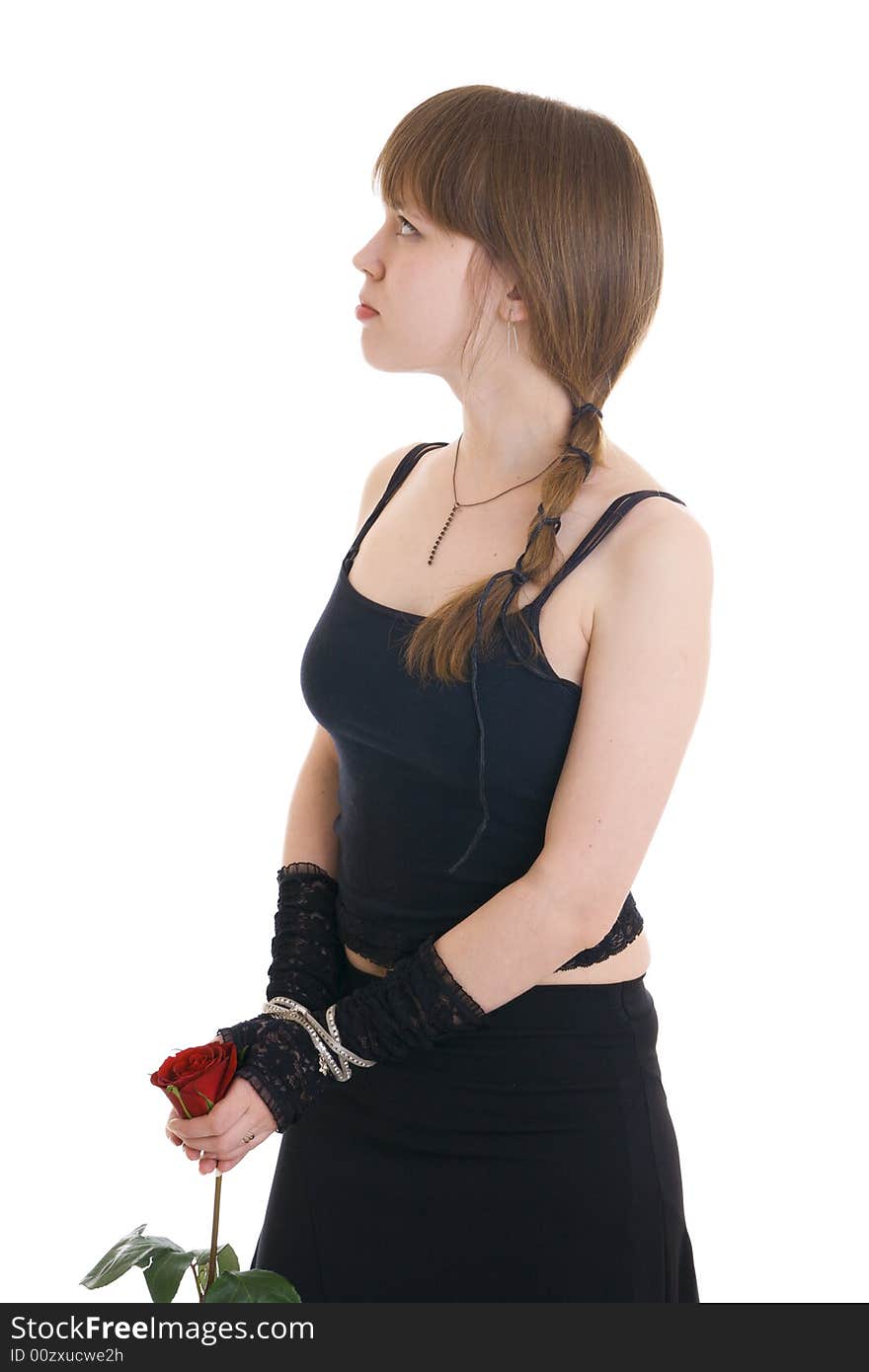 The attractive girl in a black dress isolated on a white background