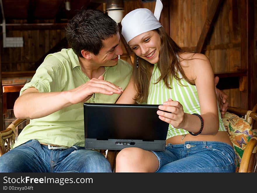 Young man and woman making internet searching. Young man and woman making internet searching