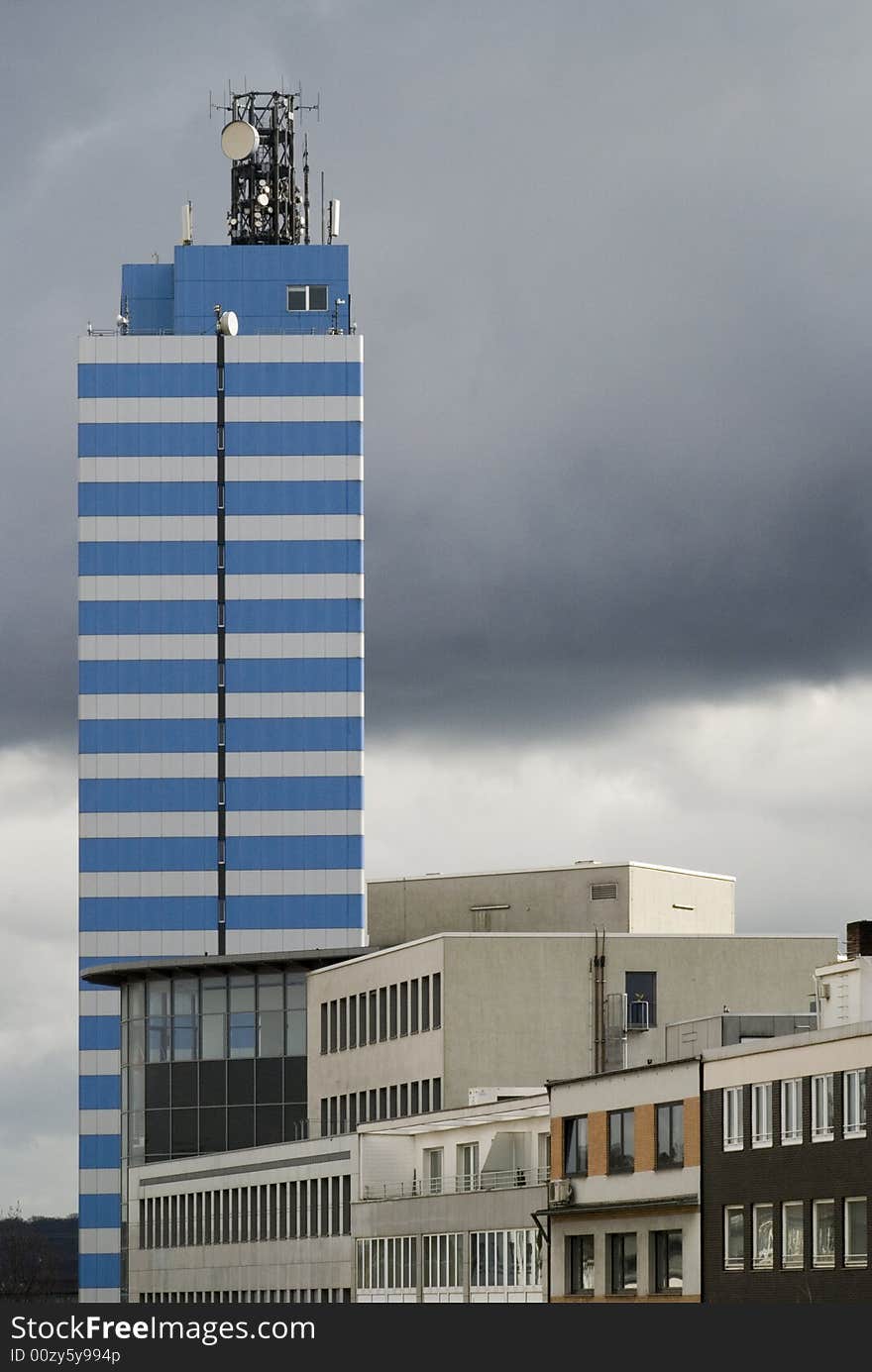 Skyscraper in the dark clouds