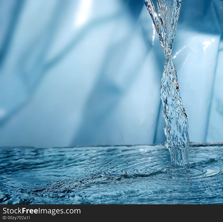 Water droping from the top into another water. Water droping from the top into another water